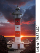 Lighthouse Punta de Teno is Tenerife on the Atlantic Ocean. Стоковое фото, агентство Ingram Publishing / Фотобанк Лори