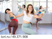 Middle-aged woman and girl are dancing vigorous pair dance in couple. Стоковое фото, фотограф Яков Филимонов / Фотобанк Лори