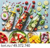 Summer refreshing and extra hydrating infused water in bottles with ingredients, top view. Various fruits and berries water flavor combinations. Summer drinks. Healthy and clean detox beverages. Стоковое фото, агентство Ingram Publishing / Фотобанк Лори