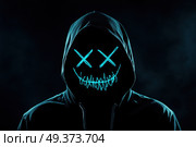 Неоновая маска в капюшоне ночью. Стоковое AI-изображение, AI-художник Александр Жуков / Фотобанк Лори