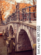 Amsterdam is autumn. Yellow trees among streets and canals. Стоковое фото, агентство Ingram Publishing / Фотобанк Лори