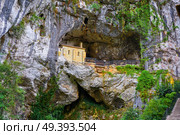 Covadonga Santa Cueva a Catholic sanctuary cave in Asturias near Picos europa mountains. Стоковое фото, агентство Ingram Publishing / Фотобанк Лори