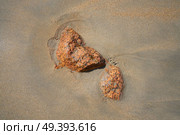 Granite Porrino stone in the Galician beach sand shore of spain. Стоковое фото, агентство Ingram Publishing / Фотобанк Лори