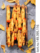 Homemade cookies in the form of terrible human finger. Homemade halloween cookies. Стоковое фото, агентство Ingram Publishing / Фотобанк Лори