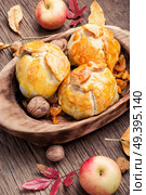 Autumn apples baked in dough. Autumn dessert.National dish of Czech and Slovak cuisine. Autumn apple dumpling. Стоковое фото, агентство Ingram Publishing / Фотобанк Лори