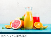 Citrus fresh juices - red and yellow one with oranges and grapefruits. Citrus juices. Стоковое фото, агентство Ingram Publishing / Фотобанк Лори