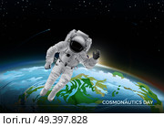 Festive card for Cosmonautics day graphic design. Vector illustration of flying cosmonaut in white suit in space. Dark sky with bright stars and burning comets. Part of planet Earth on background.. Festive Card for Cosmonautics Day Graphic Design. Стоковая иллюстрация, агентство Ingram Publishing / Фотобанк Лори