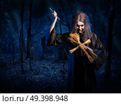 Scary witch in night forest version. Стоковое фото, агентство Ingram Publishing / Фотобанк Лори