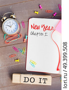 New Year resolutions in open agenda with copy space with words do it. Open agenda with copy space. Стоковое фото, агентство Ingram Publishing / Фотобанк Лори