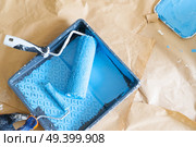 House renovation tools colored in blue paint on brown craft paper. House renovation tools. Стоковое фото, агентство Ingram Publishing / Фотобанк Лори