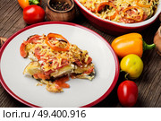 Stewed, baked zucchini, tomatoes and peppers.Traditional French vegetable dish. Diet vegetarian vegan food. Стоковое фото, агентство Ingram Publishing / Фотобанк Лори