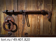 Wooden vintage door with latch rusty lock in Pyrenees of Spain. Стоковое фото, агентство Ingram Publishing / Фотобанк Лори