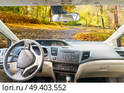 car windscreen with country fall road, view inside out. car windscreen with road. Стоковое фото, агентство Ingram Publishing / Фотобанк Лори