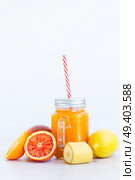 Fresh smoothy orange drink in glass jars with igredients. Fresh smoothy orange drink. Стоковое фото, агентство Ingram Publishing / Фотобанк Лори
