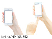 WARSAW, POLAND - JULY 17: Someones hands holding and pointing at new Iphone 5 SE. New Iphone 5 SE. Редакционное фото, агентство Ingram Publishing / Фотобанк Лори