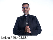 Priest pastor portrait praying hands relaxed. Стоковое фото, агентство Ingram Publishing / Фотобанк Лори