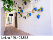 Poble Espanyol street, with traditional for Andalusia white walls architecture, Barcelona, Catalonia Spain. Poble Espanyol, Barcelona. Стоковое фото, агентство Ingram Publishing / Фотобанк Лори