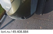 The car is parked on the side of the road so that its bumper is visible. Bright sun. Стоковое видео, видеограф Ярославский Максим / Фотобанк Лори