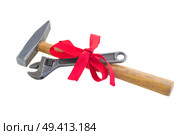 easy renovations concept spanner and hummer with red bow isolated on white background. Стоковое фото, агентство Ingram Publishing / Фотобанк Лори
