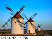 Mota del Cuervo windmills in Cuenca at Castile la Mancha of spain. Стоковое фото, агентство Ingram Publishing / Фотобанк Лори