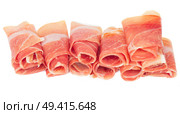 slices of fresh spanish cured pork ham jamon isolated on white background. Стоковое фото, агентство Ingram Publishing / Фотобанк Лори