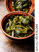 Pickled sea kale in the bowl.Fresh seaweed salad.Kelp Salad. Heap of sea kale. Стоковое фото, агентство Ingram Publishing / Фотобанк Лори