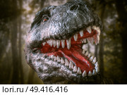 dinosaur tyrannosaurus rex growls in the forest. Стоковое фото, агентство Ingram Publishing / Фотобанк Лори