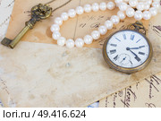 pile of old letters  and antique  clock vintage bckground with copy space. Стоковое фото, агентство Ingram Publishing / Фотобанк Лори