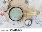pile of old letters  under  antique  finding glass vintage bckground with copy space. Стоковое фото, агентство Ingram Publishing / Фотобанк Лори