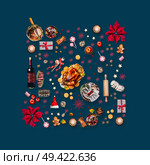 Various Christmas foods and red decoration for Christmas dinner. Composition pattern on dark blue background, top view. Стоковое фото, агентство Ingram Publishing / Фотобанк Лори