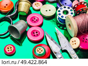 Accessories for tailoring.Bright assorted sewing buttons in mix colors. Set of tailoring accessories. Стоковое фото, агентство Ingram Publishing / Фотобанк Лори