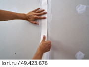 laminated plasterboard plastering join tape DIY detail. Стоковое фото, агентство Ingram Publishing / Фотобанк Лори