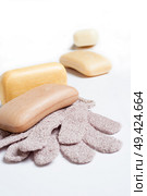 high-grade natural aroma soaps with washing mitten at wite background. Стоковое фото, агентство Ingram Publishing / Фотобанк Лори