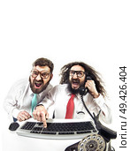 Two nerdy pals in the office. Стоковое фото, агентство Ingram Publishing / Фотобанк Лори