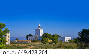 Faro de Santa Pola lighthouse in Alicante at Costa blanca of Spain. Стоковое фото, агентство Ingram Publishing / Фотобанк Лори