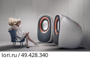 Young fashionable woman listening to big loudspeakers. Стоковое фото, агентство Ingram Publishing / Фотобанк Лори