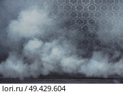 Old vintage rrom filled with dense white smoke. Стоковое фото, агентство Ingram Publishing / Фотобанк Лори