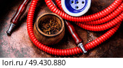 Turkish hookah .Smoking turkish shisha.Tobacco in a snuffbox and hookah. Smoking shisha with tobacco. Стоковое фото, агентство Ingram Publishing / Фотобанк Лори