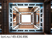 Bottom view on Headquarters of Fuji TV at Odaiba island. Fuji TV Studios building was designed by famous Kenzo Tange and is one of most recognized buildings in Japan.. Bottom view on Headquarters of Fuji TV at Odaiba island, Tokyo, Japan. Стоковое фото, агентство Ingram Publishing / Фотобанк Лори