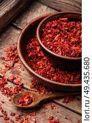 Crushed red cayenne pepper.Spice for meat dishes. Dried red chilli flakes. Стоковое фото, агентство Ingram Publishing / Фотобанк Лори