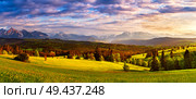 Poland spring Tatra mountains panorama. Beautiful valley and cloudy sky. Green spring sunset meadows on hills. Vacation, travel in Europe. Стоковое фото, агентство Ingram Publishing / Фотобанк Лори