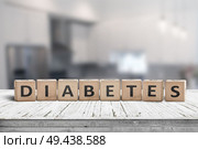 Diabetes disease sign on a table in a bright kitchen in daylight. Стоковое фото, агентство Ingram Publishing / Фотобанк Лори