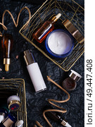 set of nature precious oils and  care cosmetics on black background . Стоковое фото, агентство Ingram Publishing / Фотобанк Лори