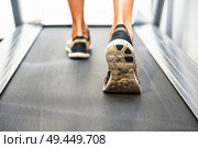 Male muscular feet in sneakers running on the treadmill at the gym. Concept for fitness, exercising and healthy lifestyle. Стоковое фото, агентство Ingram Publishing / Фотобанк Лори