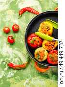 Colorful baked,stuffed peppers with rice and minced meat. Stuffed peppers with meat. Стоковое фото, агентство Ingram Publishing / Фотобанк Лори