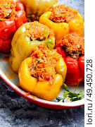 Stuffed bell peppers with minced meat.Baked bell pepper. Stuffed peppers in a baked pot. Стоковое фото, агентство Ingram Publishing / Фотобанк Лори