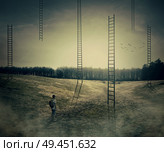 Young boy on a mystic meadow with a lot of ladders going high in the sky, thinking which to climb. Different life opportunities, best choice and career development concept. Стоковое фото, агентство Ingram Publishing / Фотобанк Лори
