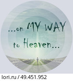 Inspirational words, on my way to heaven, as a man walking on a country road with a relax mood, following a light in the sky. Way of life concept. Стоковое фото, агентство Ingram Publishing / Фотобанк Лори