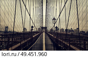 None on Brooklyn Bridge in New York City, Manhattan closeup with skyscrapers and city skyline over Hudson River. Стоковое фото, агентство Ingram Publishing / Фотобанк Лори