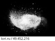 Freeze motion of colorful powder paint exploding isolated on black dark background. Abstract design of color dust cloud. Particles explosion screen saver, wallpaper, brush. Стоковое фото, агентство Ingram Publishing / Фотобанк Лори